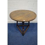 AN 18TH CENTURY CIRCULAR OAK PLANK TOP CRICKET TABLE, with joint splayed turned legs, united by