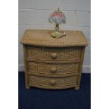 A WICKER SERPENTINE CHEST OF THREE LONG DRAWERS, width 87cm x depth 56cm x height 78cm, together