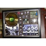 BEATLES INTEREST: a framed and glazed montage of facsimile photographs, a gold disc with CD of Abbey