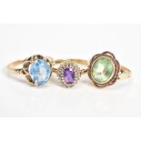 THREE 9CT GOLD GEM SET RINGS, to include an oval cut topaz within a scallop surround, with a 9ct