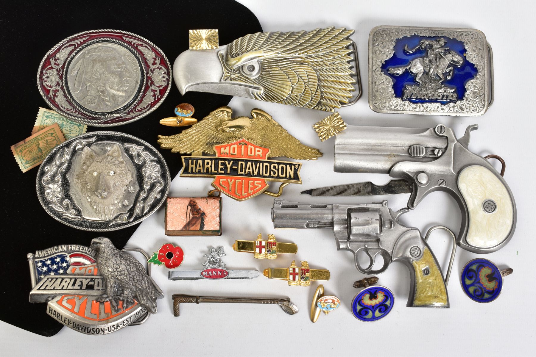 A SELECTION OF ITEMS, to include eight belt buckles in forms such as Harley Davidson motor cycles,