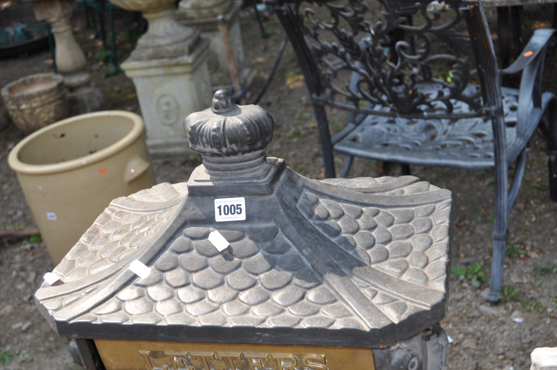 A MODERN CAST IRON POST BOX, with Chinese pagoda style roof, horse and rider detail to casting on - Image 4 of 4