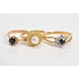 THREE GEM SET RINGS, the first of cluster design set with a central circular cut sapphire with a