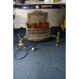 A BRASS AND STEEL ELECTRIC FIRE, with brass dogs attached and amber coloured coals (PAT pass and