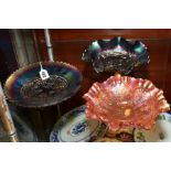 TWO PURPLE CARNIVAL GLASS FOOTED DISHES, one with grape decoration, approximate diameter 23cm and