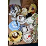 A BOX OF ASSORTED CERAMICS, including trios, Crown Staffordshire ginger jar and cover, Carltonware