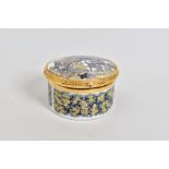 A ROYAL WORCESTER 'THE CONNOISSSEUR COLLECTION WORCESTERSHIRE COTTAGE', circular pill box, gilt