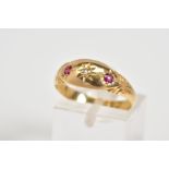 AN EARLY 20TH CENTURY 18CT GOLD GYPSY RING, set with a central single cut diamond flanked by