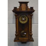 A LATE 19TH CENTURY WALNUT VIENNA WALL CLOCK (missing finials) (winding key, pendulum)