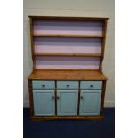 A MODERN PINE DRESSER with three drawers, approximate width 137cm x depth 46cm x height 183cm (
