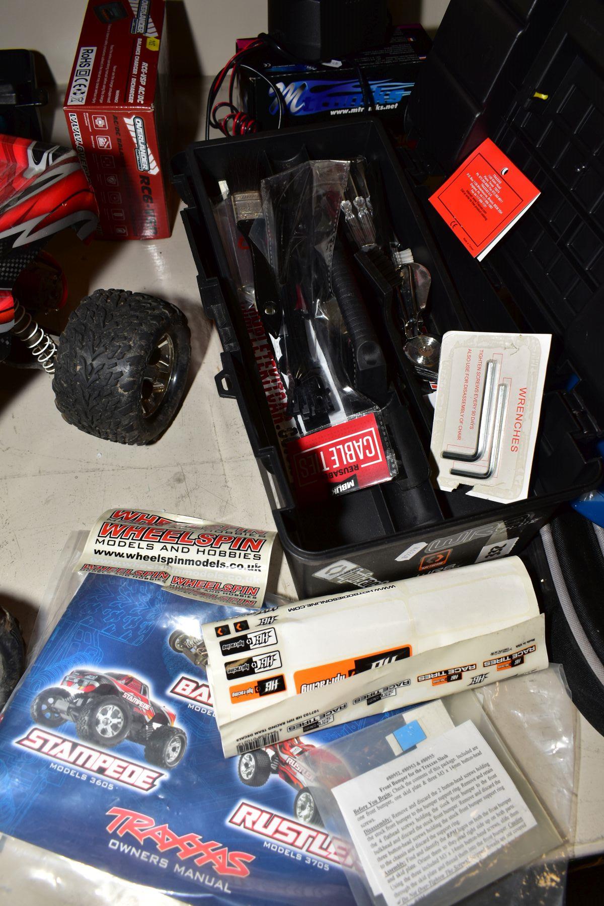 A REMOTE CONTROL TRAXXAS STAMPEDE WHEELSPIN TRUCK AND A QUANTITY OF ACCESSORIES, SPARE PARTS AND - Image 2 of 2