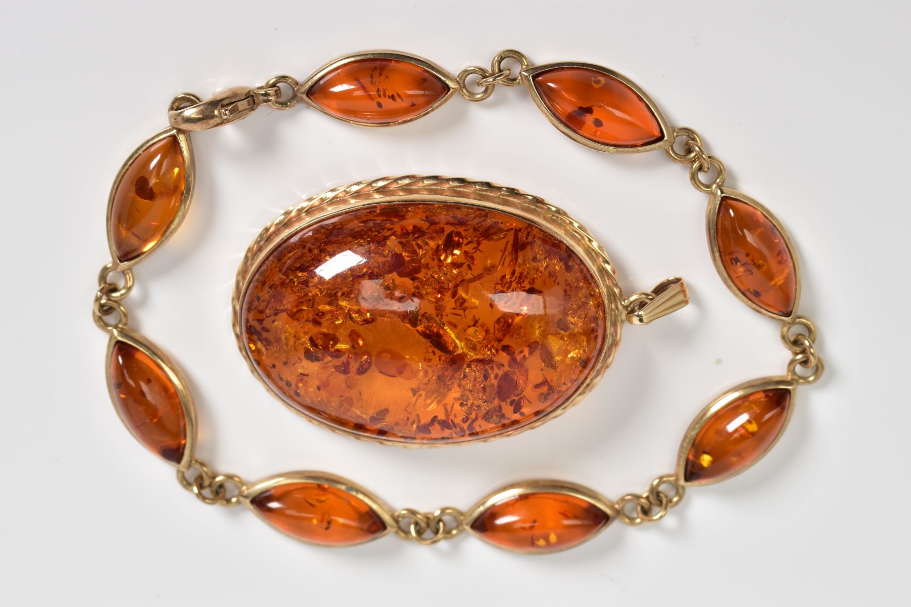 A 9CT GOLD AMBER BRACELET AND PENDANT, the bracelet designed with eight lozenge shape amber links, - Image 4 of 4