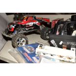 A REMOTE CONTROL TRAXXAS STAMPEDE WHEELSPIN TRUCK AND A QUANTITY OF ACCESSORIES, SPARE PARTS AND