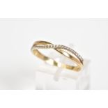 A 9CT GOLD CROSSOVER RING, the crossover design set with a row of circular cut cubic zirconia to the