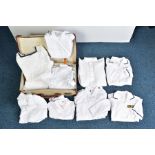 A SUITCASE CONTAINING A LARGE NUMBER OF WHITE UNIFORM DRESS SHIRTS, RN & US (blue trim) all