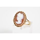 A 9CT GOLD CAMEO RING, of oval design depicting a lady in profile with a rope twist surround, to the
