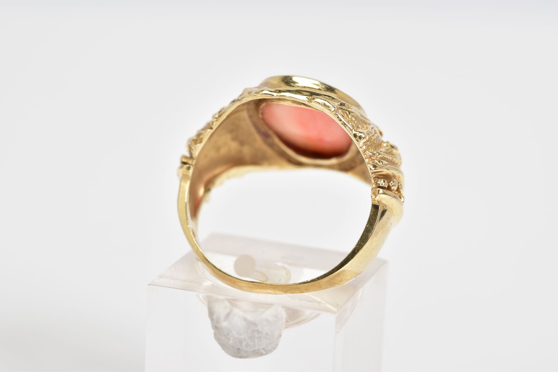 A CORAL SET RING, the yellow metal ring designed with a central oval coral panel within a collet - Image 3 of 4