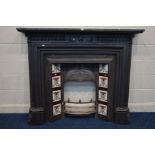 A VICTORIAN STYLE CAST IRON FIRE SURROUND and insert with Art Nouveau burgundy, green and white