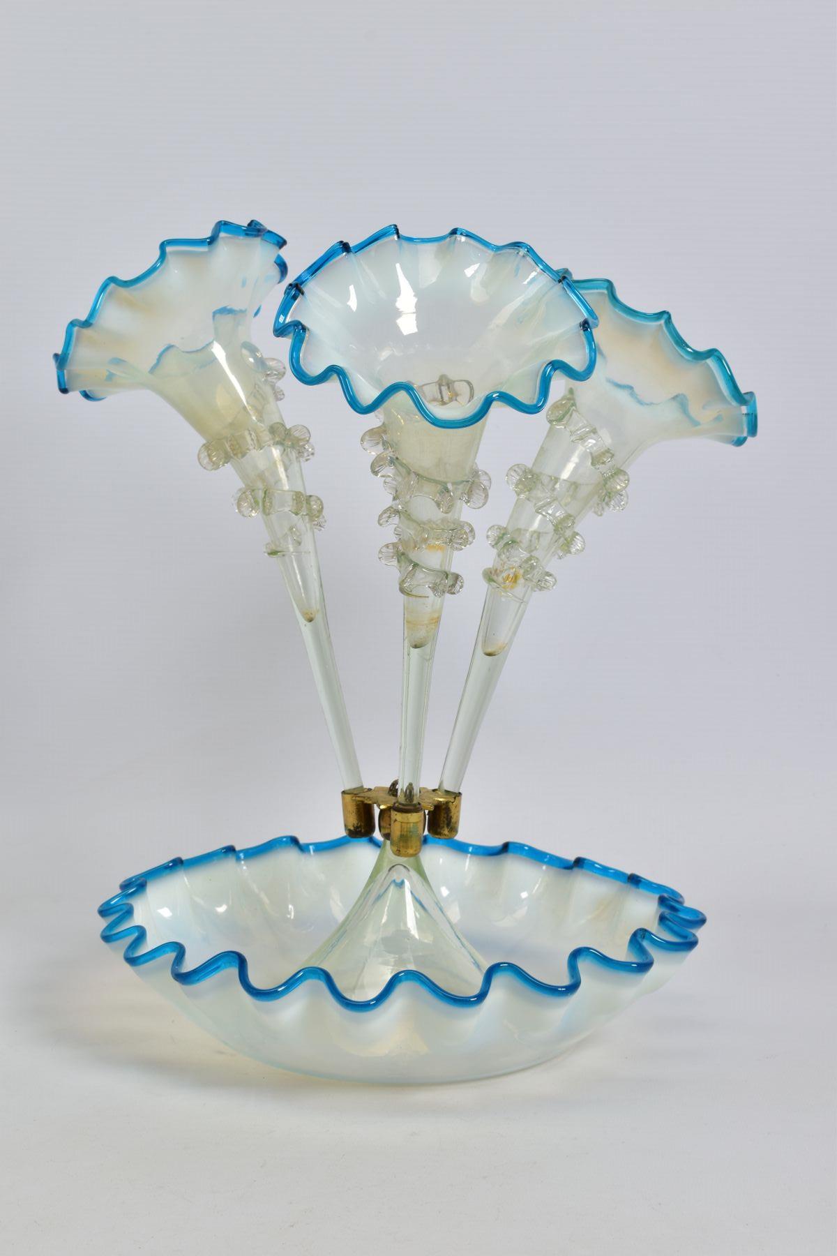 A LATE VICTORIAN BLUE, VASELINE AND CLEAR GLASS EPERGNE, three trumpets, frilled rims and with