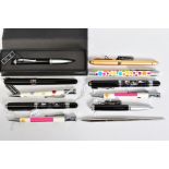 A SELECTION OF PENS, to include a black fountain pen with a picture of a map, with matching