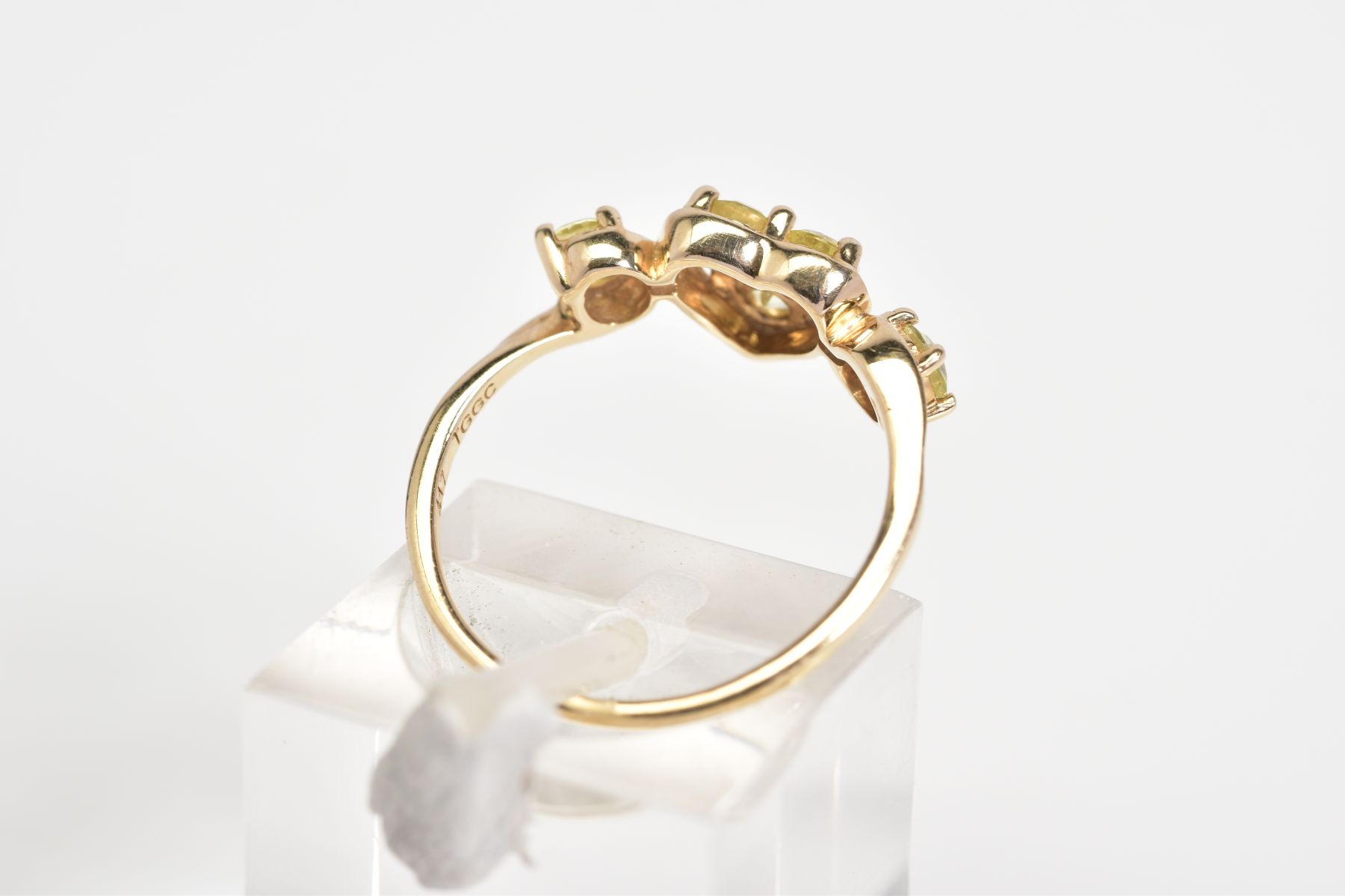 A 9CT GOLD RING, designed with a central heart panel set with three circular cut stones assessed - Image 3 of 3