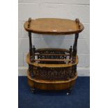 A LATE VICTORIAN BURR WALNUT CANTERBURY, shaped oval top with handles, on foliate scrolling end