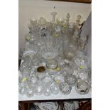 A QUANTITY OF CUT GLASS VASES, BOWLS, DECANTERS, etc, to include Tutbury Crystal, etc