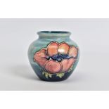 A MOORCROFT POTTERY SQUAT BALUSTER VASE, mottled blue ground with pink/purple anemone design,