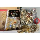 A SELECTION OF COSTUME JEWELLERY, to include a box of brooches in various forms such as flowers,