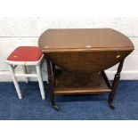 AN OAK OVAL TOP DROP LEAF TEA TROLLEY, together with a walnut circular occasional table, oak open