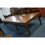 AN EARLY 20TH CENTURY OAK BOARDROOM TABLE, the top, frieze and legs solid oak, the centre table with