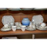 AN EARLY 20TH CENTURY SHELLEY CHINA TEA SET, printed and tinted floral and geometric design,