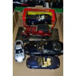 A QUANTITY OF MAINLY UNBOXED ASTON MARTIN SPORTS CAR MODELS, mostly 1/18 scale, assorted models,