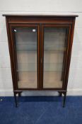 AN EDWARDIAN MAHOGANY AND INLAID DOUBLE DOOR DISPLAY CABINET, with two glass shelves on square