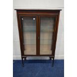 AN EDWARDIAN MAHOGANY AND INLAID DOUBLE DOOR DISPLAY CABINET, with two glass shelves on square