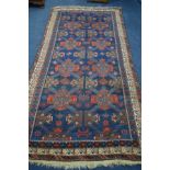 A LATE 19TH CENTURY EAGLE RAZAK BLUE GROUND RUG, the middle field with eight medallions framed by