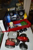 A QUANTITY OF BOXED AND UNBOXED BRITAINS ERTL AND BRUDER TRACTORS AND FARM MACHINERY, all 1/16