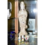 A CHINESE BLANC DE CHINE CRACKLE GLAZE FIGURE OF GUANYIN, one index finger broken, open base,