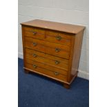 AN EDWARDIAN WALNUT CHEST OF TWO LONG OVER THREE LONG DRAWERS on bracket feet, width 105cm x depth