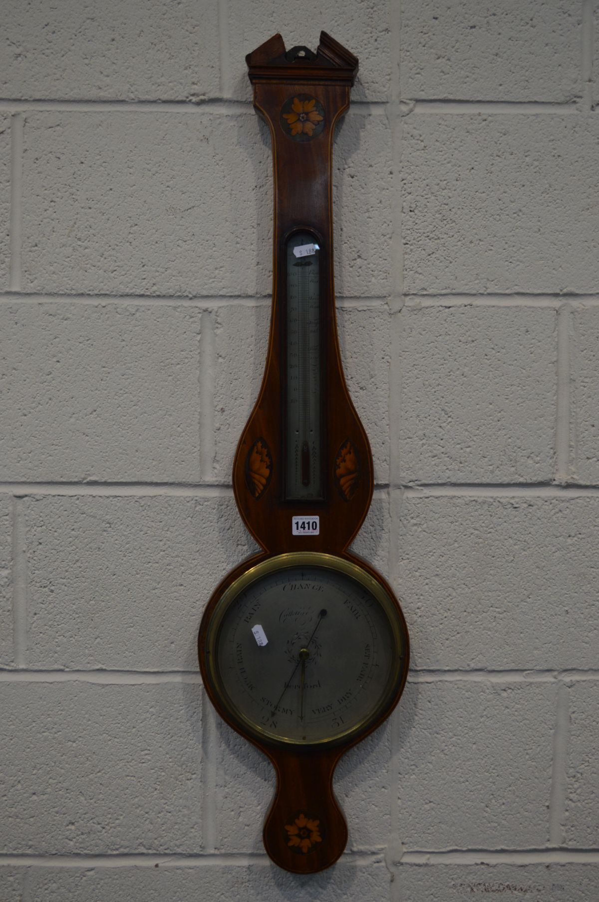 A GEORGIAN MAHOGANY STRUNG AND INLAID WHEEL BAROMETER, signed Caltelly, Hereford, with a