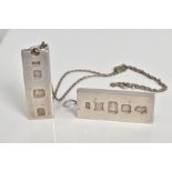 TWO SILVER INGOT PENDANTS, the first with a silver hallmark for Birmingham, length 43mm, the