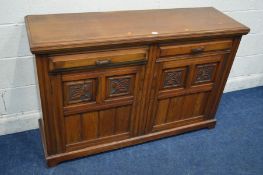 AN EDWARDIAN WALNUT SIDEBOARD with two drawers above double floral panel doors, width 137cm x