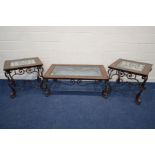 A MODERN RECTANGULAR BROWN LEATHER AND BEVELLED GLASS TOPPED COFFEE TABLE, on a scrolled wrought