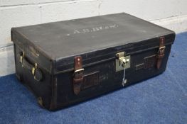 A VINTAGE BLACK GROUND AND LEATHER TRAVELLING TRUNK, with travel labels, width 83cm x depth 46cm x