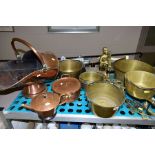 A COLLECTON OF BRASS AND COPPER WARE, including copper coal scuttle, a twin handled pan and cover,