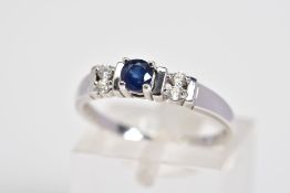 A 9CT WHITE GOLD SAPPHIRE AND DIAMOND RING, designed with a central claw set circular cut