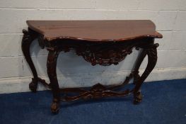 A REPRODUCTION MAHOGANY SERPENTINE FRONTED HALL TABLE with elaborate carving to the shaped frieze,
