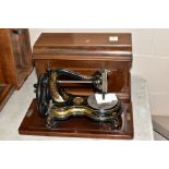 A LATE VICTORIAN JONES HAND SEWING MACHINE, serpentine arm, gilt transfer decoration, patent no