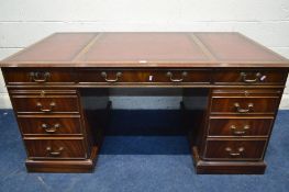 A REPRODUX MAHOGANY PEDESTAL DESK, the top with gilt tooled burgundy leather inlay, nine drawers and