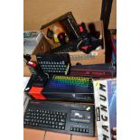 A TRAY CONTAINING TWO SINCLAIR ZX81 VINTAGE PERSONAL COMPUTERS, a Spectrum 3, various games and